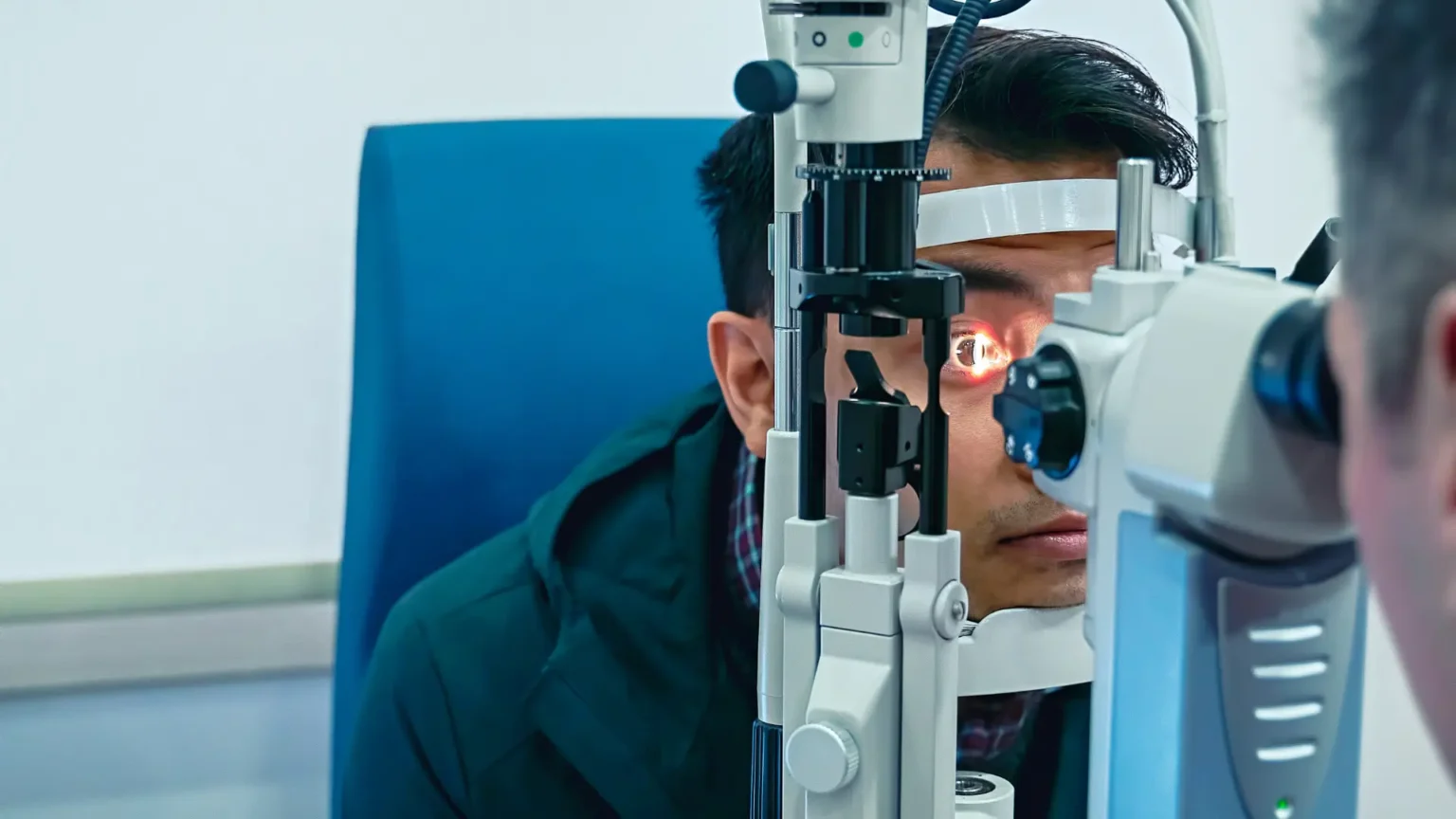 Eye doctor examining patient eyes after types of LASIK